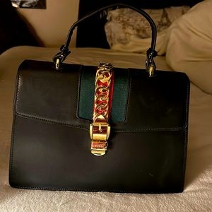NWOT Black Gucci Sylvie to match the shoes listed earlier.
